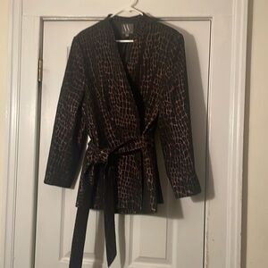 Woman’s beautiful gold and black blazer, formal..